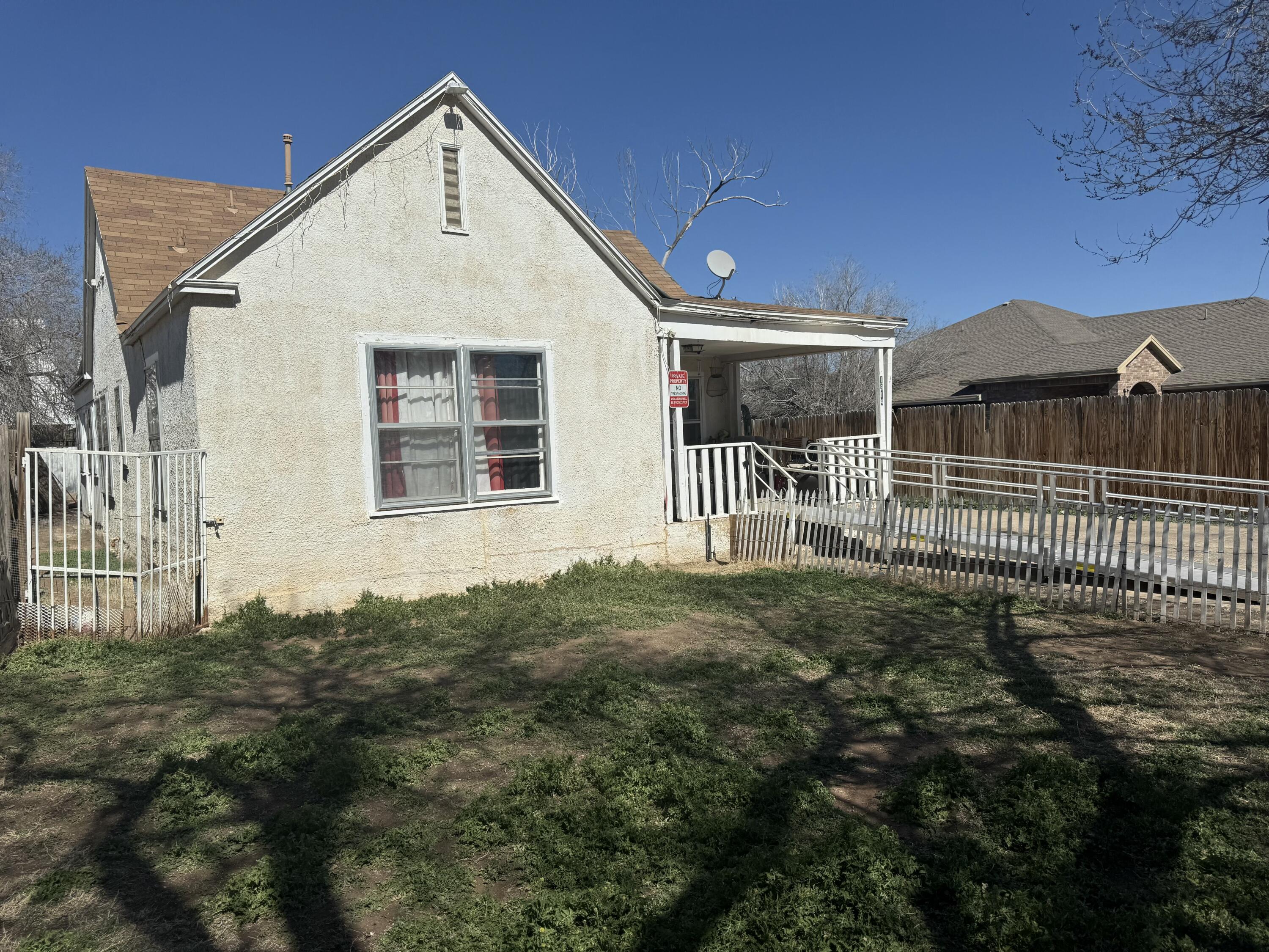 Package Package Property Lubbock, TX 79411 - Photo 2 of 71 a front view of a house with a yard