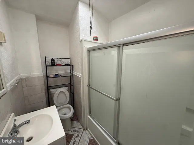 a bathroom with a toilet and a sink