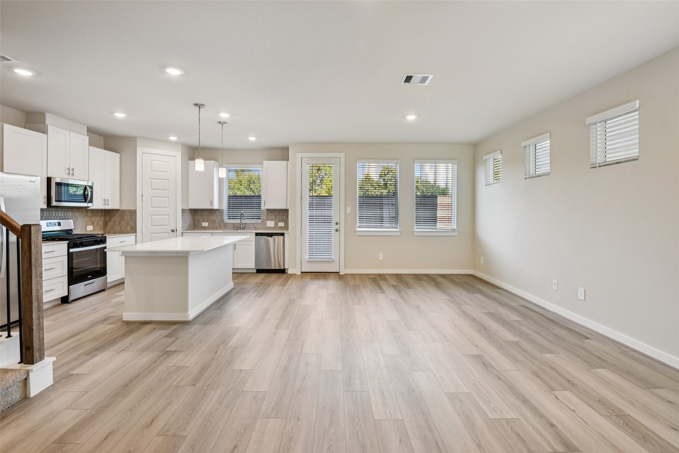 10012 Rustic Charm Street Houston, TX 77080 - Photo 11 of 45 a large kitchen with stainless steel appliances granite countertop a large counter top and a stove top oven