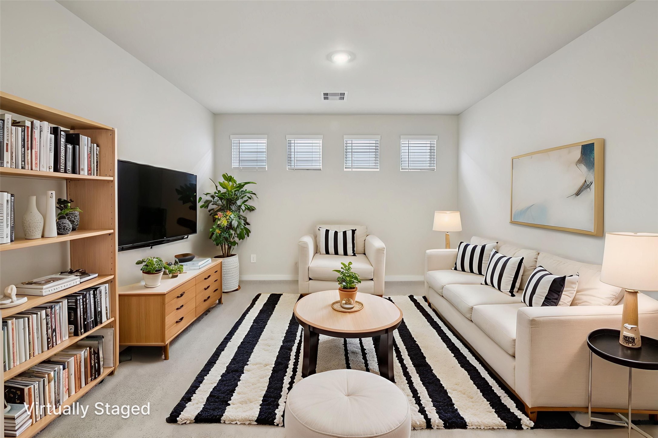 10012 Rustic Charm Street Houston, TX 77080 - Photo 19 of 45 a living room with furniture and a flat screen tv