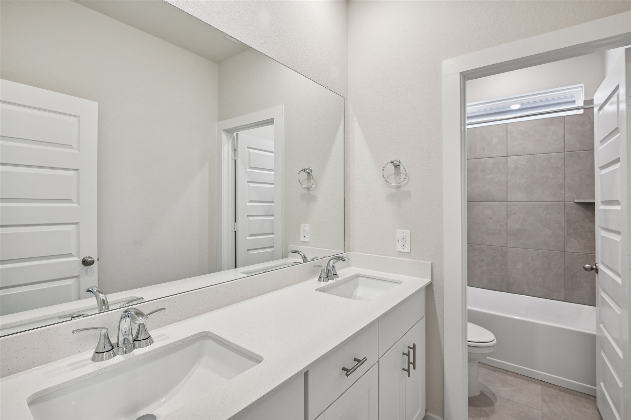 10012 Rustic Charm Street Houston, TX 77080 - Photo 23 of 45 a bathroom with a granite countertop sink toilet and shower