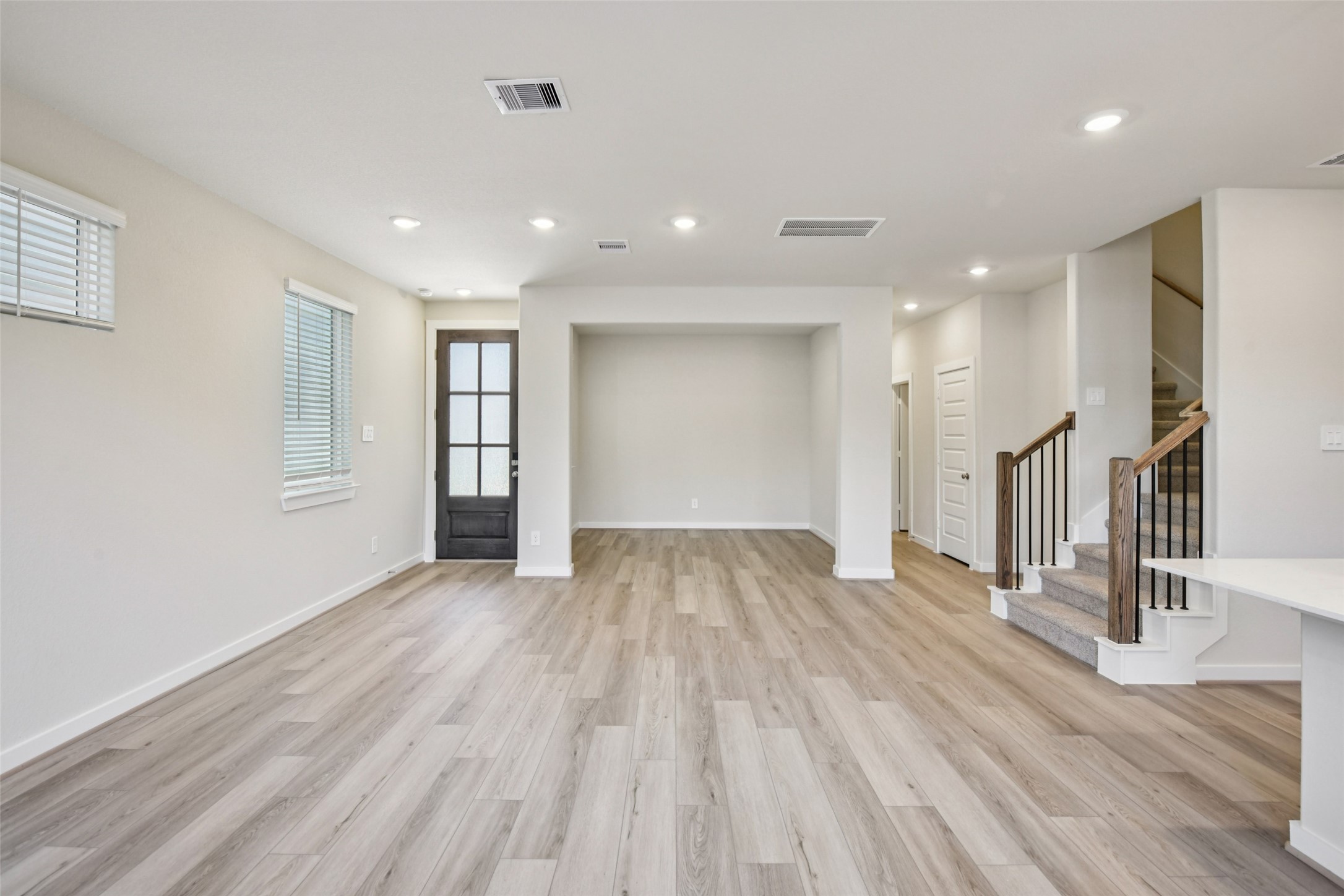 10012 Rustic Charm Street Houston, TX 77080 - Photo 3 of 45 a view of empty room with wooden floor