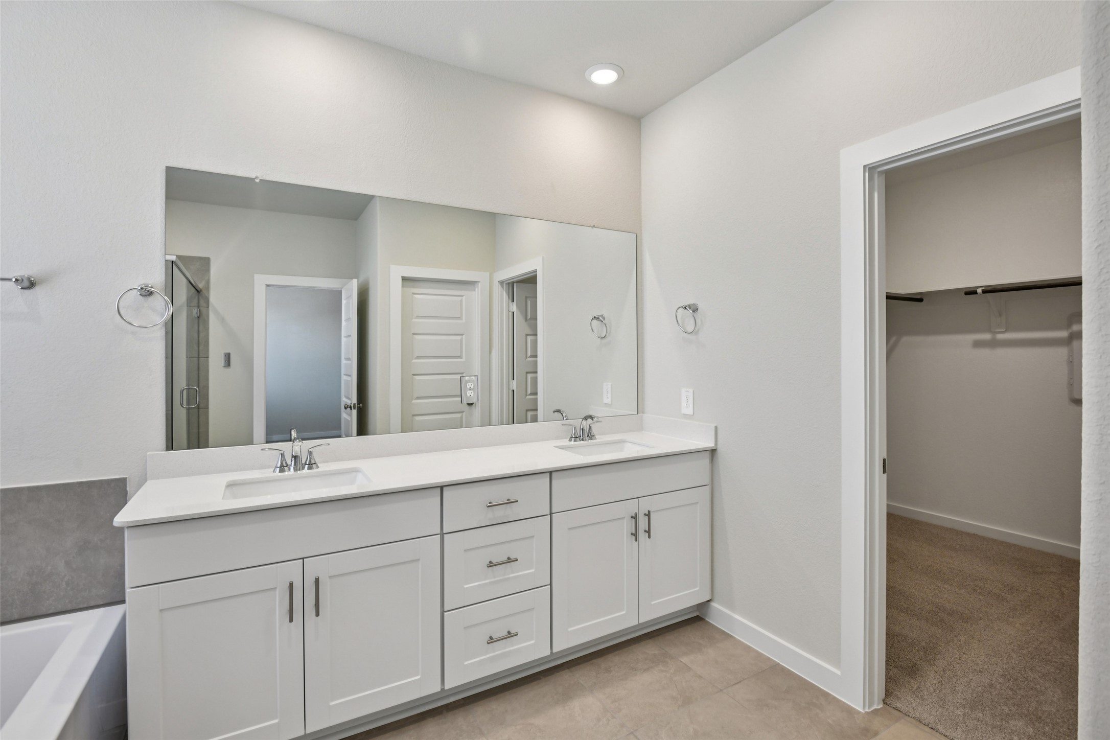 10012 Rustic Charm Street Houston, TX 77080 - Photo 38 of 45 a bathroom with double sink and a mirror