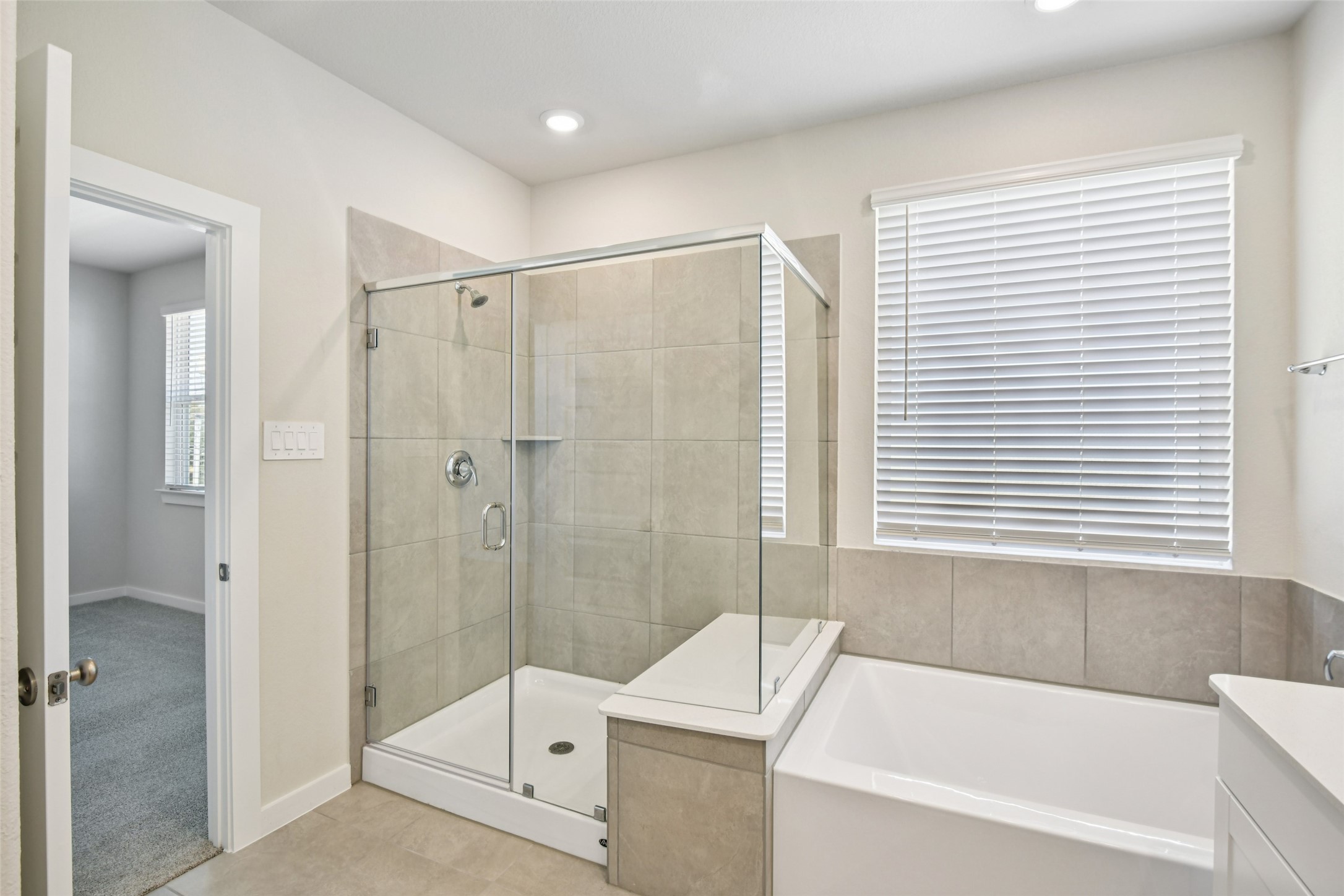 10012 Rustic Charm Street Houston, TX 77080 - Photo 39 of 45 a bathroom with a bathtub and a shower