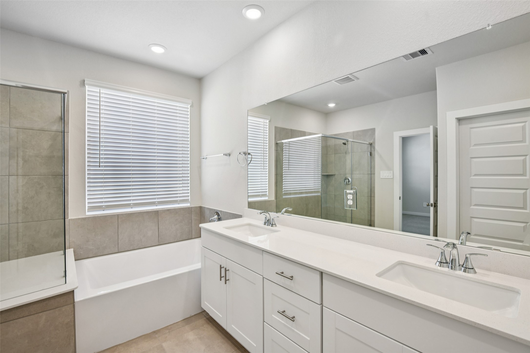 10012 Rustic Charm Street Houston, TX 77080 - Photo 40 of 45 a bathroom with a large tub sink and mirror