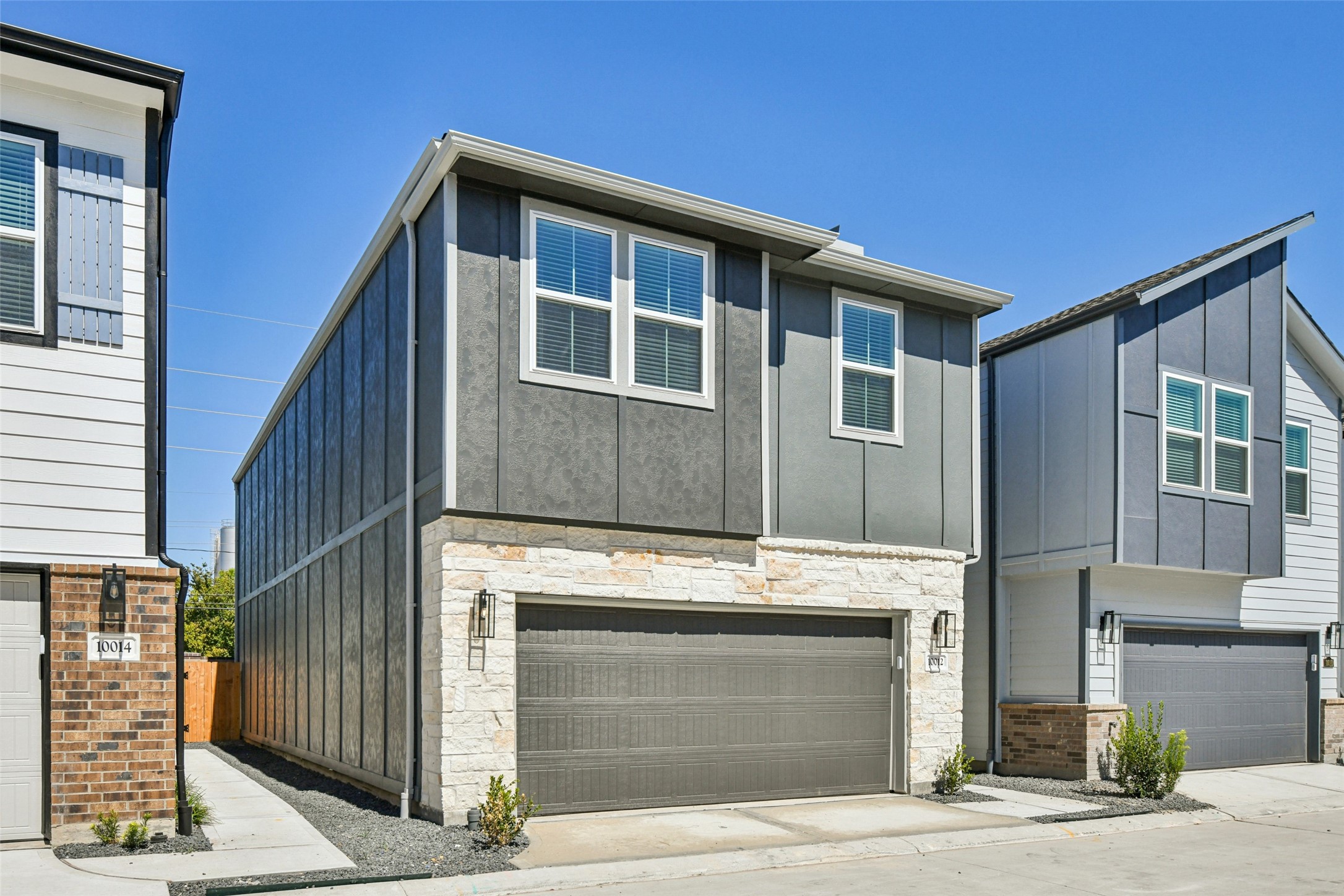 10012 Rustic Charm Street Houston, TX 77080 - Photo 45 of 45 a front view of a house with a garage