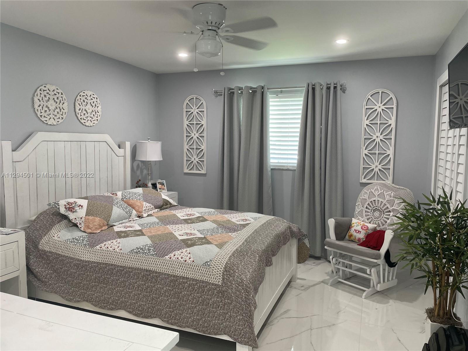 2222 Southwest 138th Avenue Miami, FL 33175 - Photo 16 of 27 a bedroom with a bed and furniture