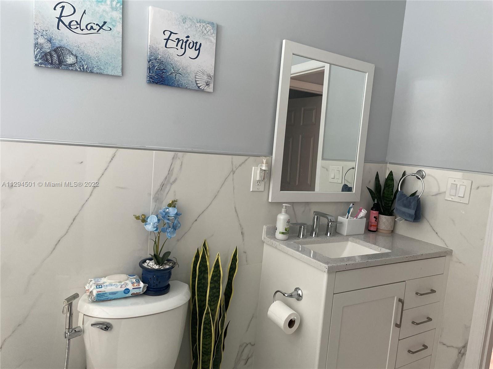 2222 Southwest 138th Avenue Miami, FL 33175 - Photo 17 of 27 a bathroom with a sink and a mirror