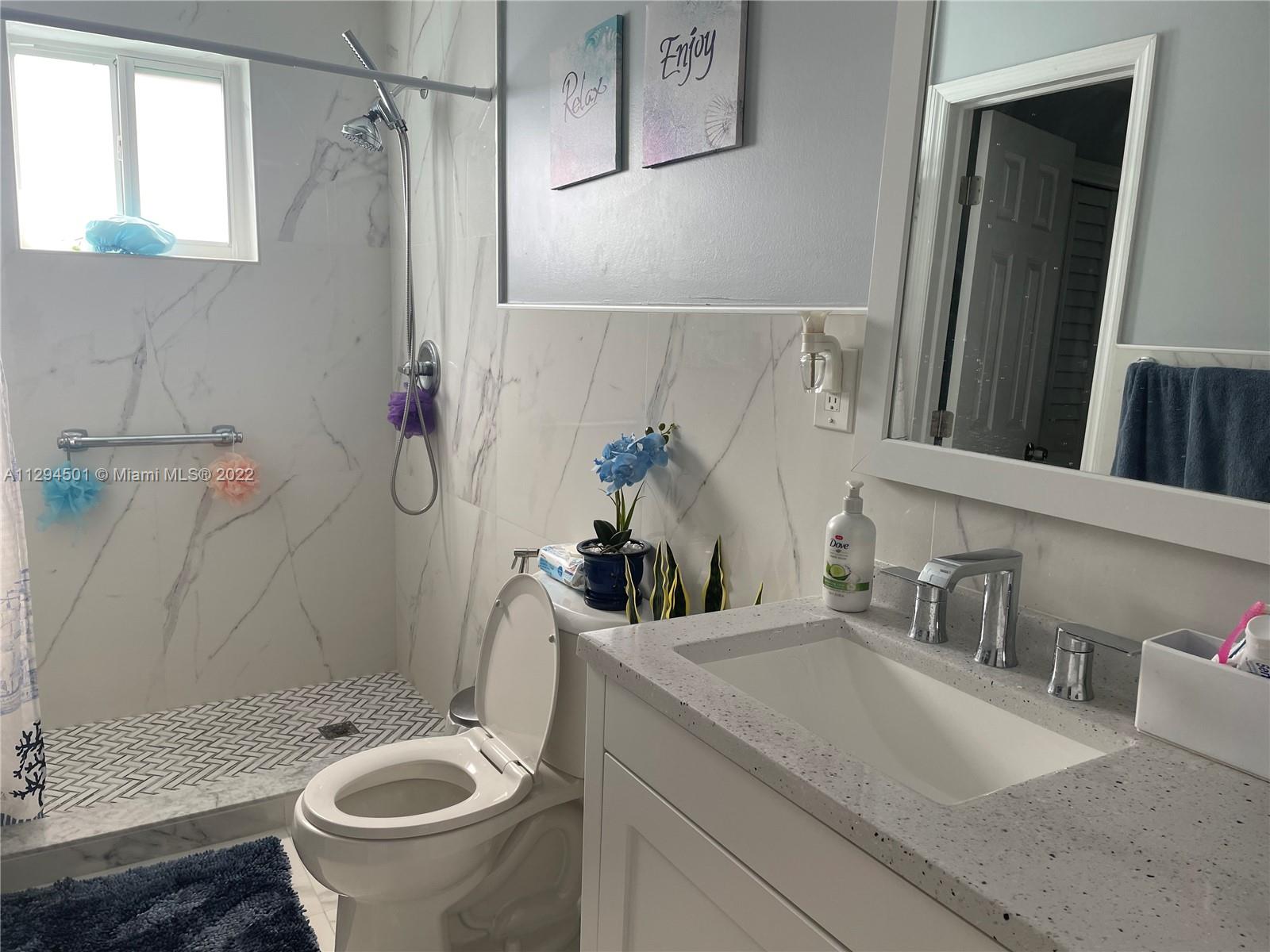 2222 Southwest 138th Avenue Miami, FL 33175 - Photo 18 of 27 a bathroom with a sink and mirror