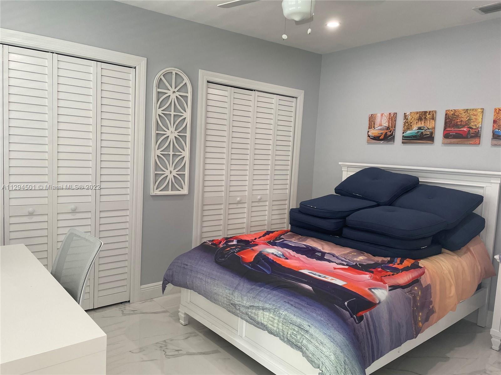 2222 Southwest 138th Avenue Miami, FL 33175 - Photo 19 of 27 a bedroom with a bed and window