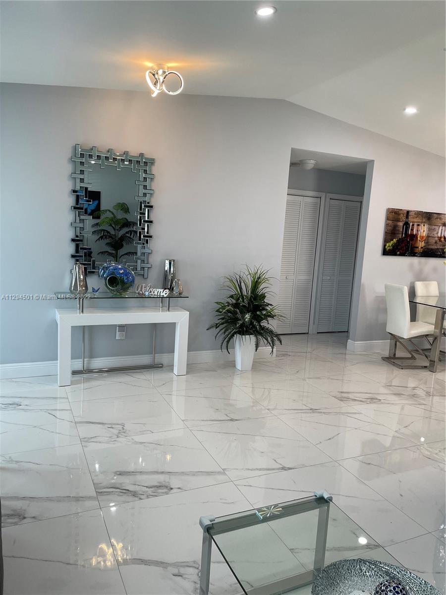 2222 Southwest 138th Avenue Miami, FL 33175 - Photo 4 of 27 a living room with furniture and a potted plant