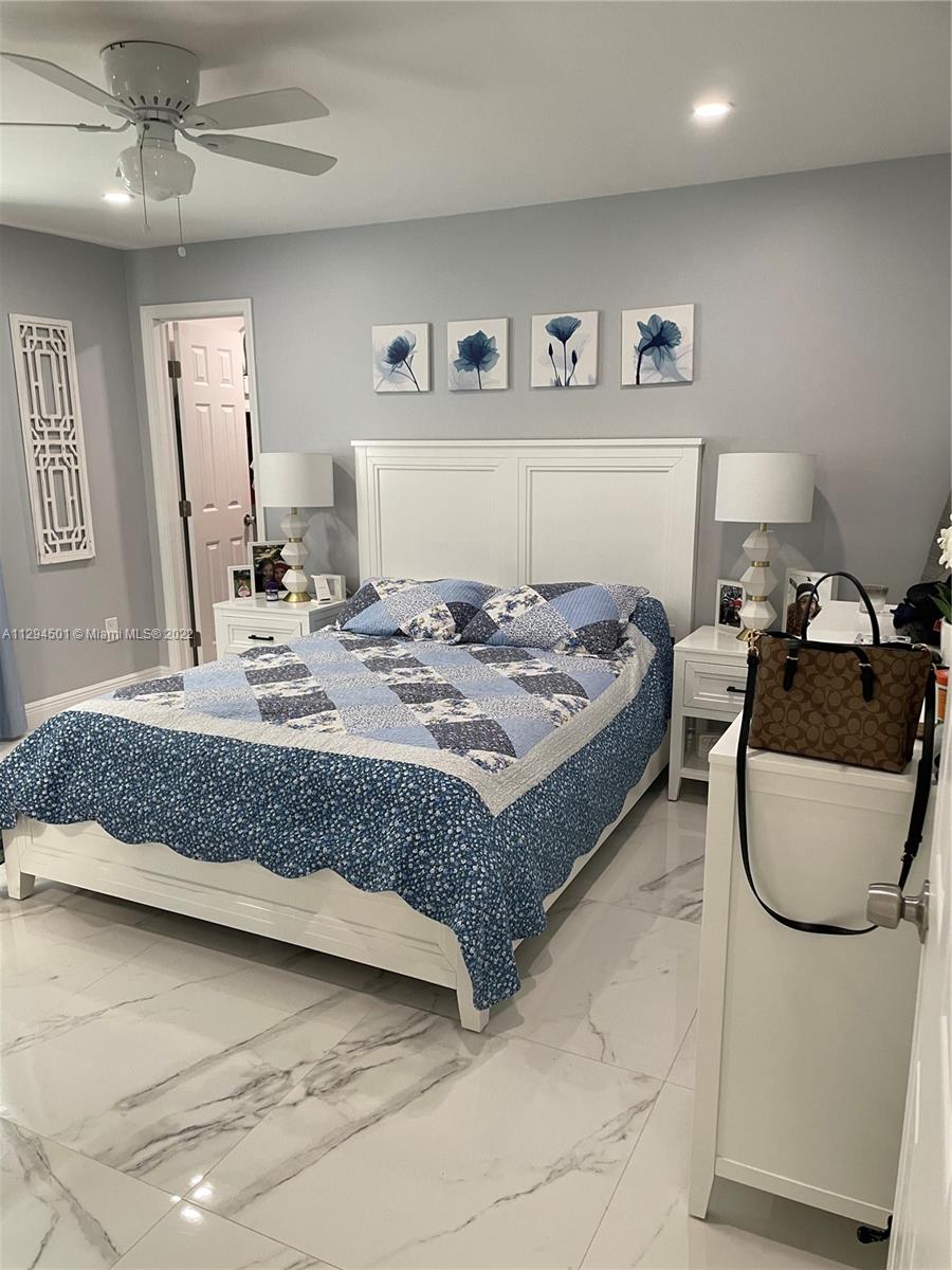 2222 Southwest 138th Avenue Miami, FL 33175 - Photo 6 of 27 a bedroom with a bed and wall painting