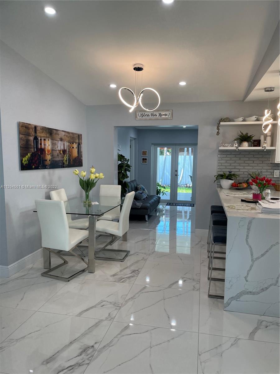 2222 Southwest 138th Avenue Miami, FL 33175 - Photo 8 of 27 a living room with furniture and a flat screen tv
