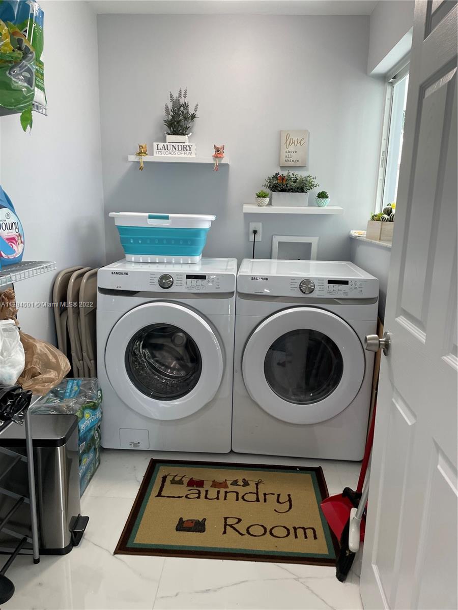 2222 Southwest 138th Avenue Miami, FL 33175 - Photo 9 of 27 a utility room with dryer and washer