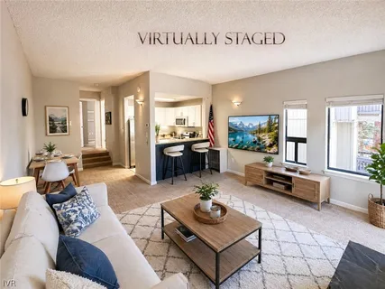 a living room with furniture and a table