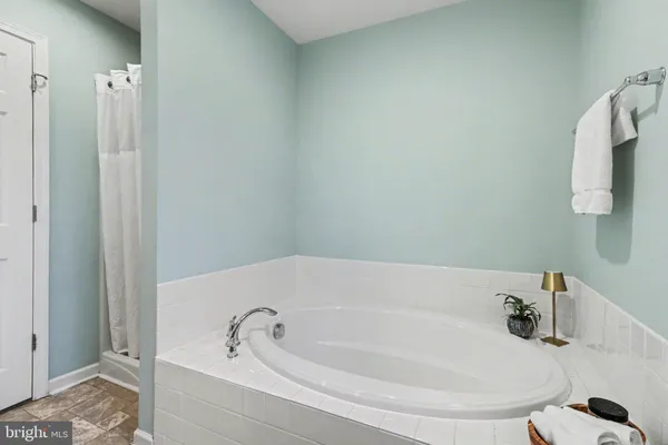 a white bath tub sitting in a bathroom