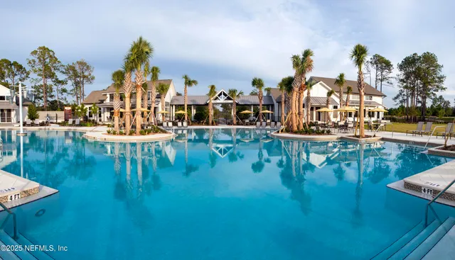 a living room with lots of furniture and wooden floor