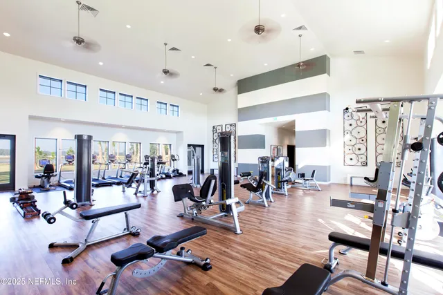a kitchen with white cabinets and appliances