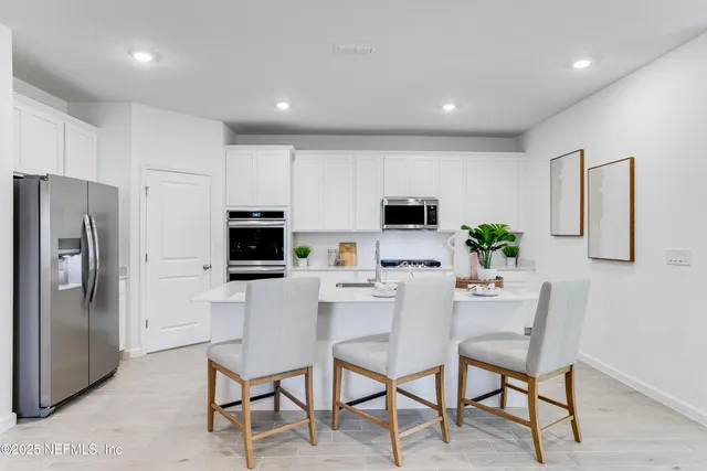 a view of a dining room with furniture