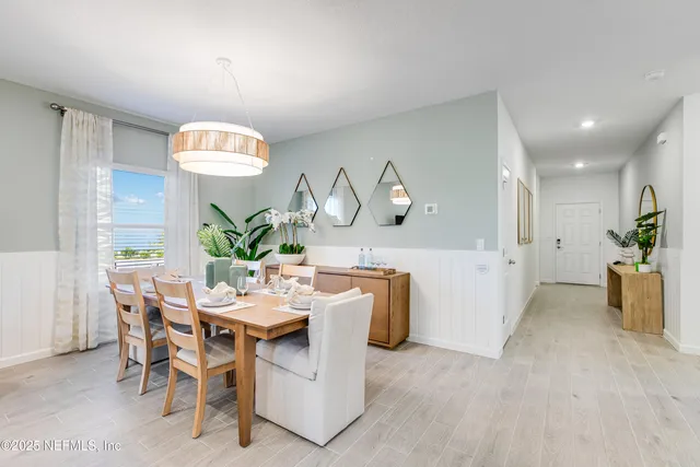 a view of a porch with chairs and backyard