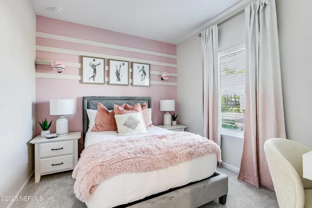 a bedroom with a bed and a night stand