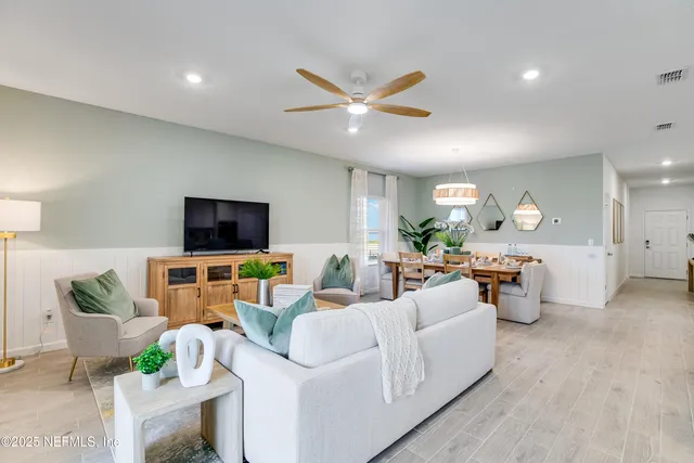 a spacious bedroom with a bed and a window