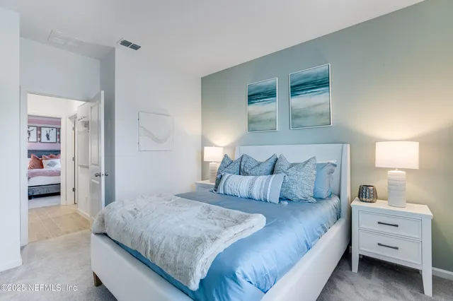 a bathroom with a granite countertop sink a mirror and shower