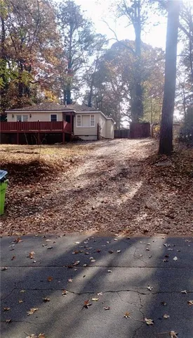 a view of house with a yard