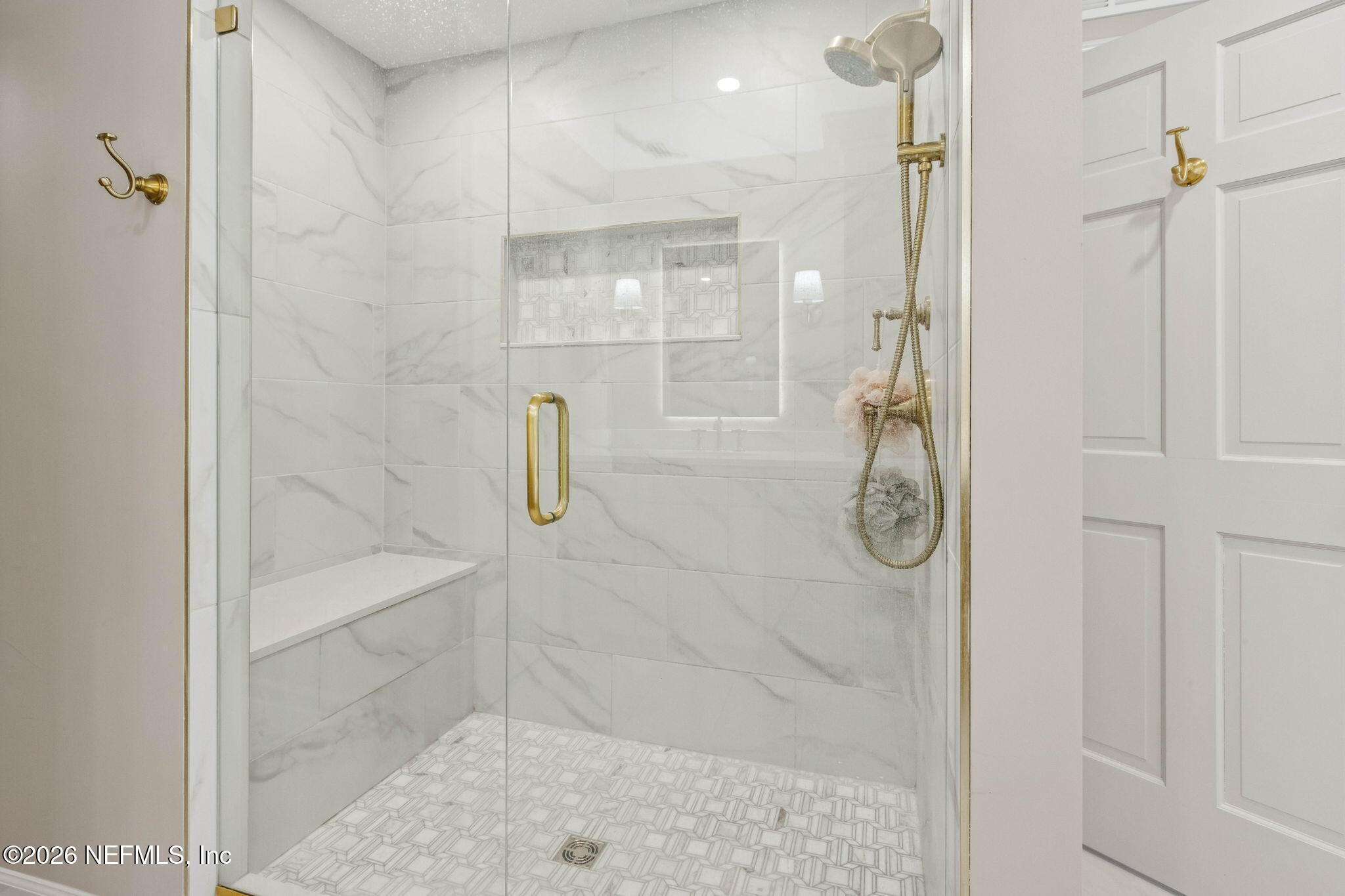 6518 Christopher Point Road West Jacksonville, FL 32217 - Photo 54 of 102 a bathroom with a glass shower door