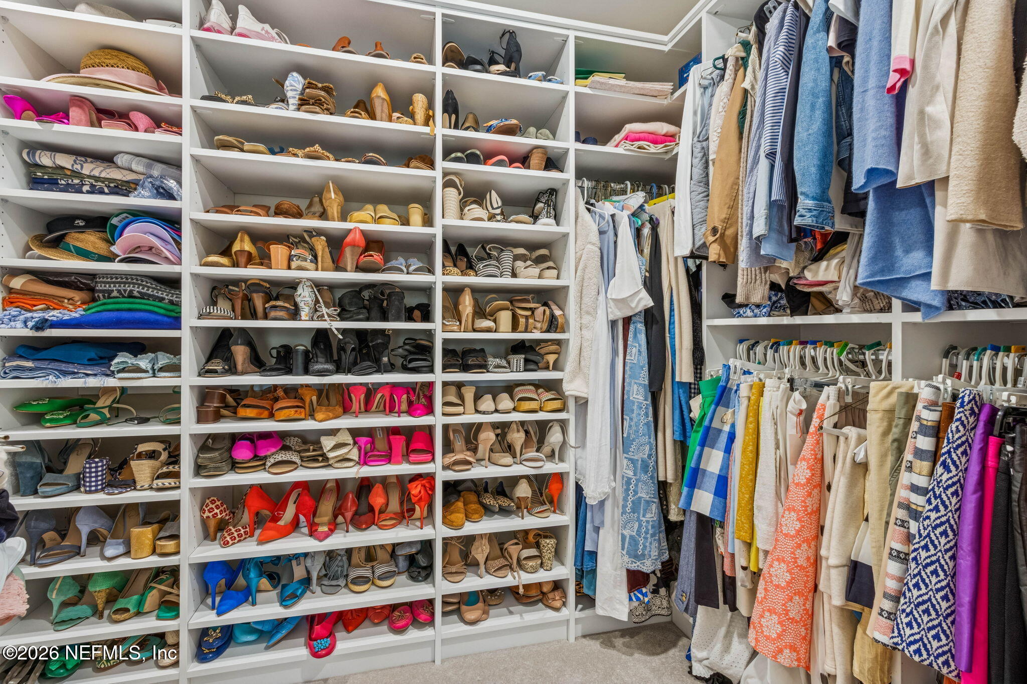 6518 Christopher Point Road West Jacksonville, FL 32217 - Photo 55 of 102 a view of walk in closet with clothes and shoes
