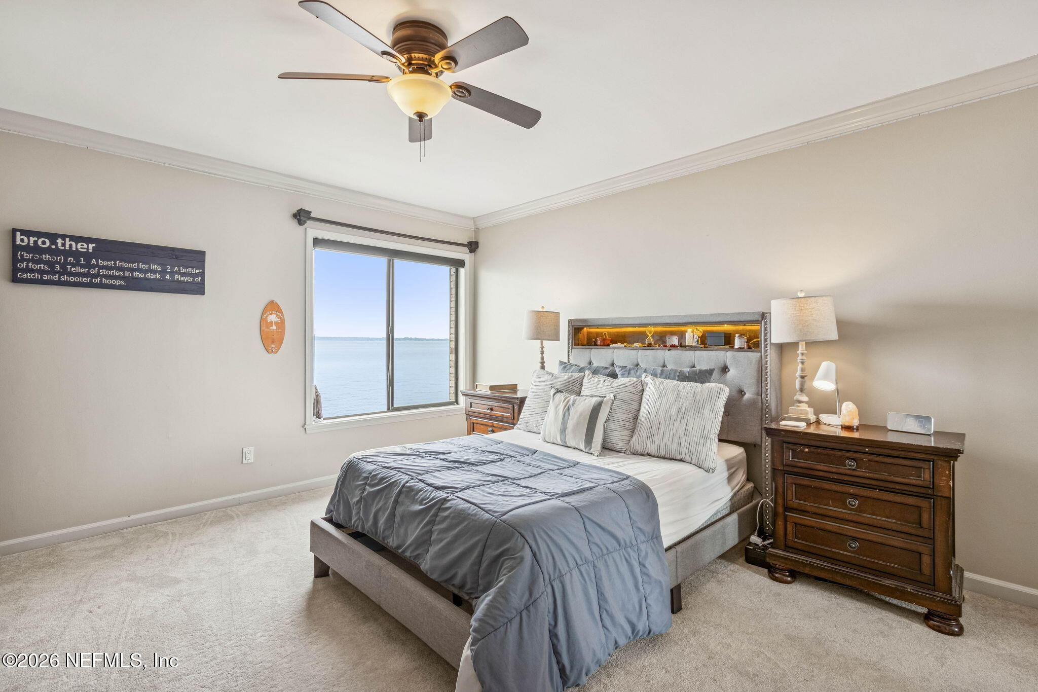 6518 Christopher Point Road West Jacksonville, FL 32217 - Photo 65 of 102 a bedroom with a bed and a chandelier