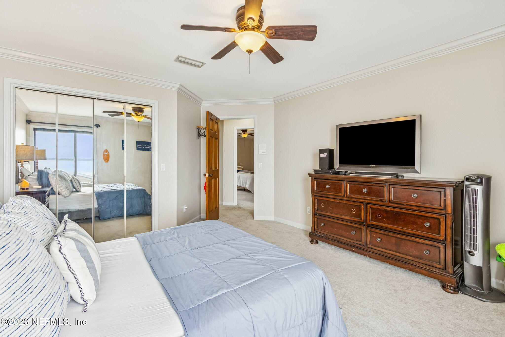 6518 Christopher Point Road West Jacksonville, FL 32217 - Photo 66 of 102 a bedroom with a bed and a flat screen tv