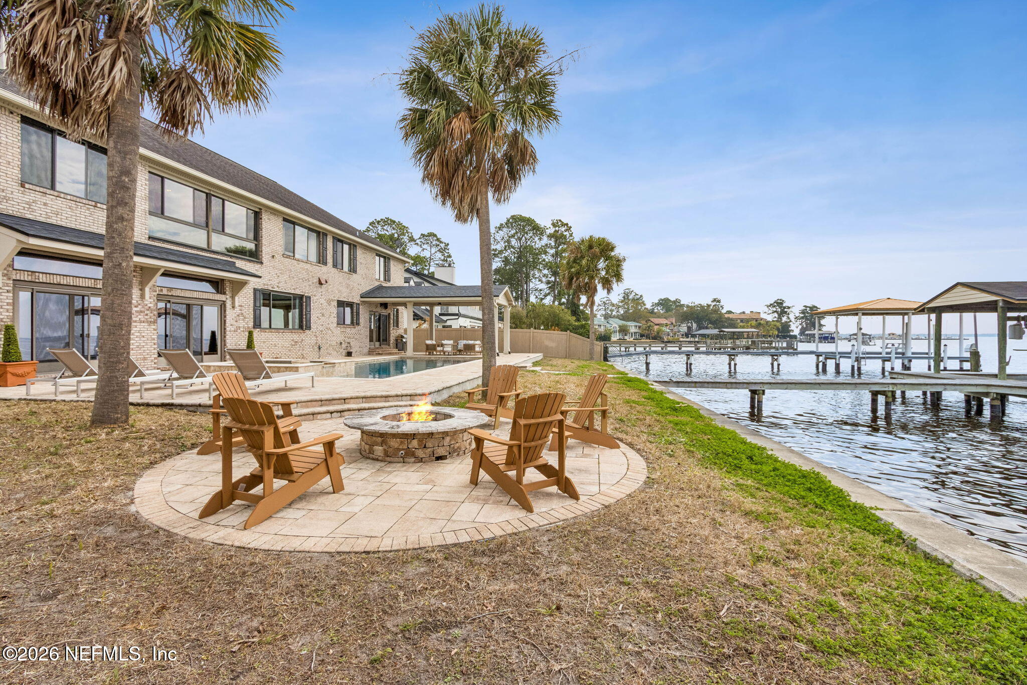 6518 Christopher Point Road West Jacksonville, FL 32217 - Photo 91 of 102 a swimming pool with outdoor seating and yard