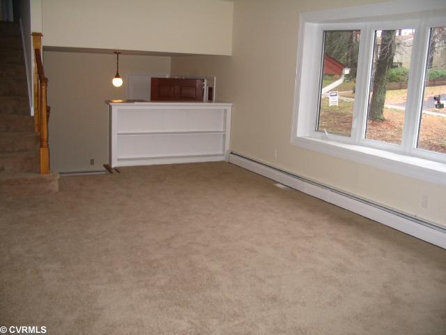 3931 Beulah Road Richmond, VA 23237 - Photo 4 of 11 Living Room - New carpet, bay window, bookcases