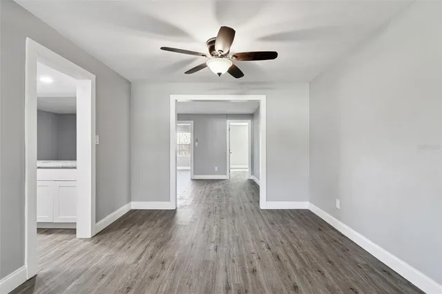 a kitchen with granite countertop a sink and cabinets