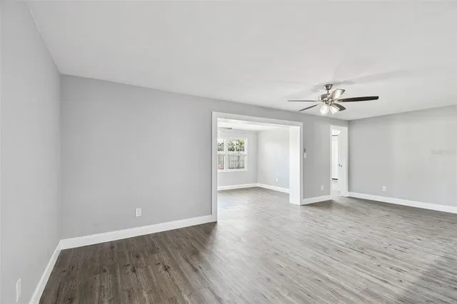 a view of an empty room with a window
