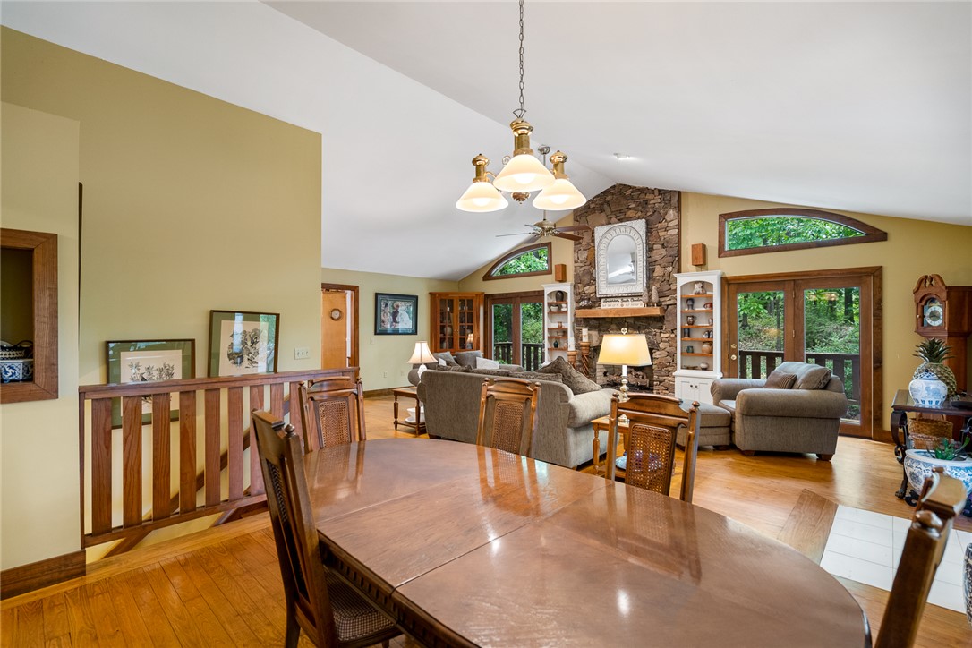 324 Hobson Road Anderson, SC 29621 - Photo 14 of 46 This inviting space features a vaulted ceiling, a stone fireplace, and hardwood flooring.