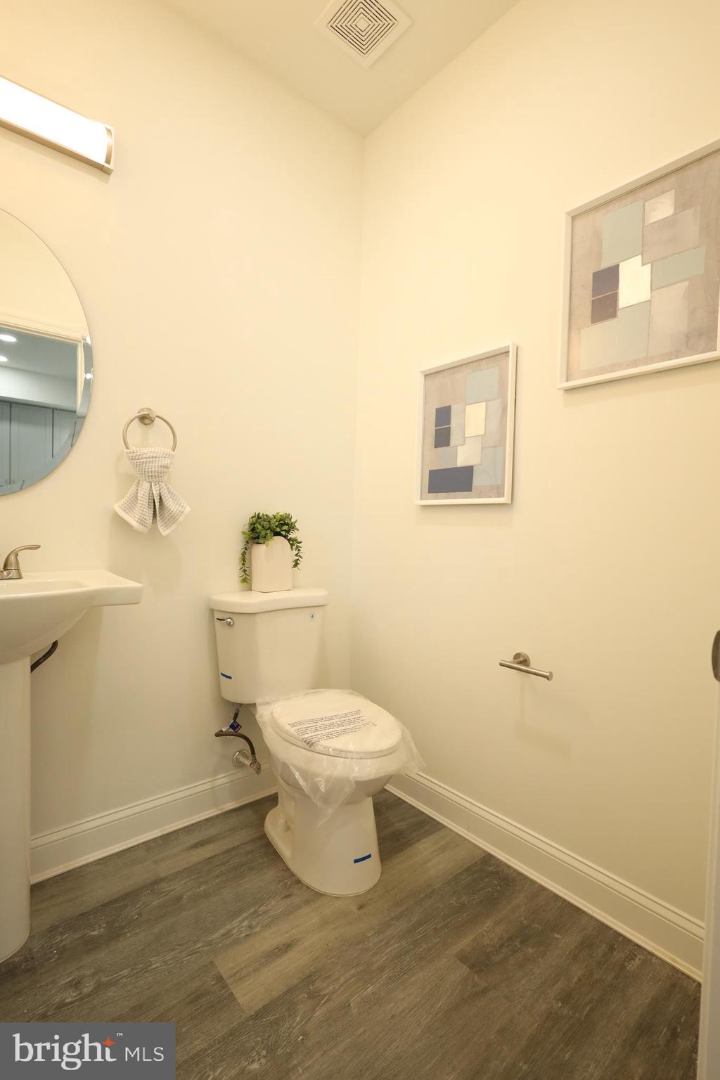 3316 North Market Street Wilmington, DE 19802 - Photo 11 of 40 a white toilet sitting next to a bathroom sink