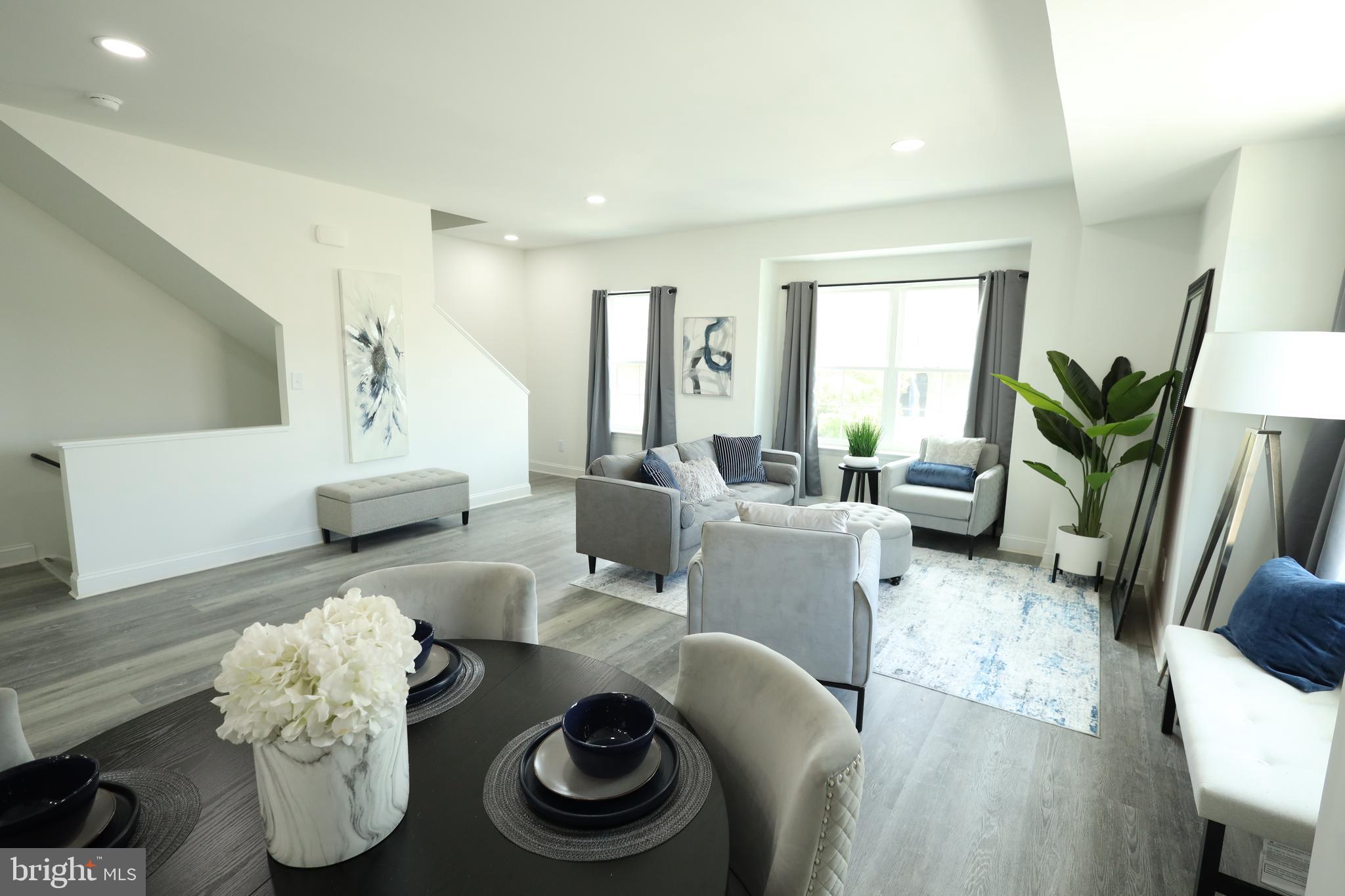 3316 North Market Street Wilmington, DE 19802 - Photo 13 of 40 a living room with furniture and a potted plant