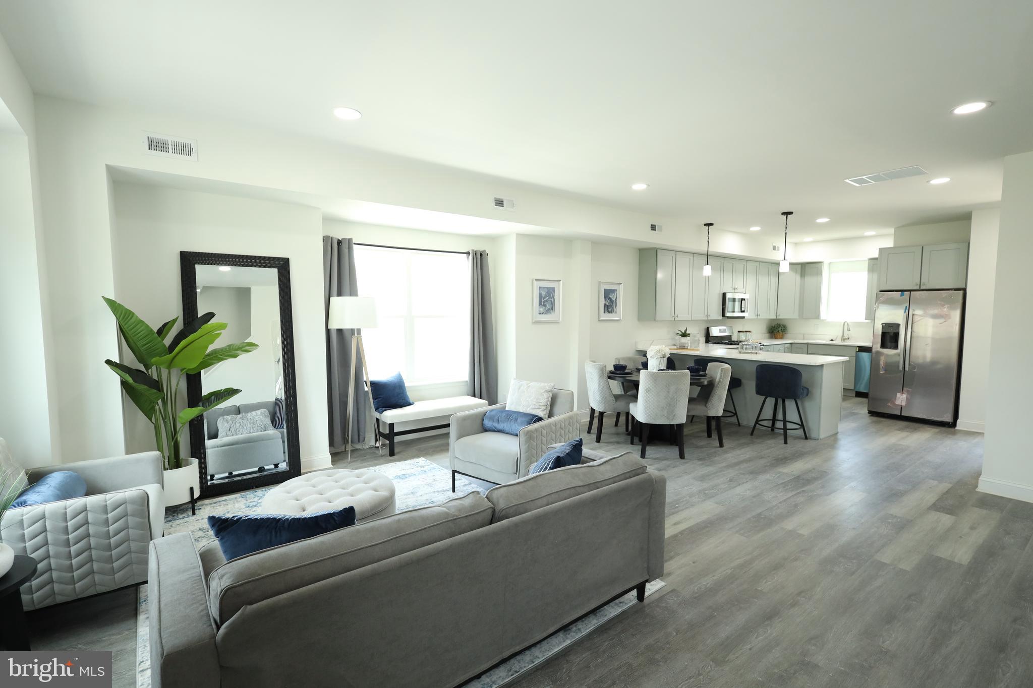 3316 North Market Street Wilmington, DE 19802 - Photo 17 of 40 a living room with furniture and a potted plant