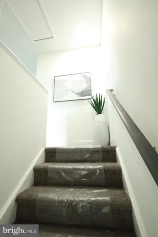 a bed room with a bed and a painting