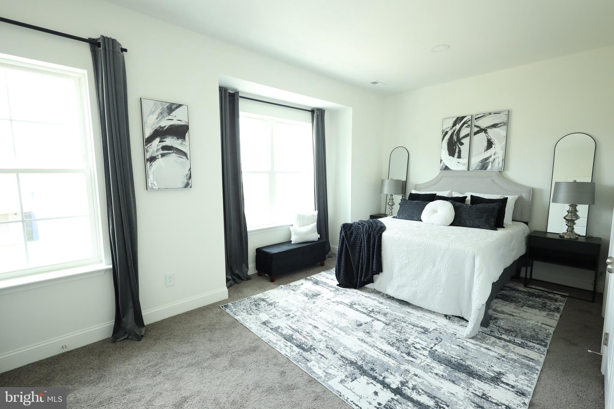 3316 North Market Street Wilmington, DE 19802 - Photo 20 of 40 a bedroom with a bed and wooden floor