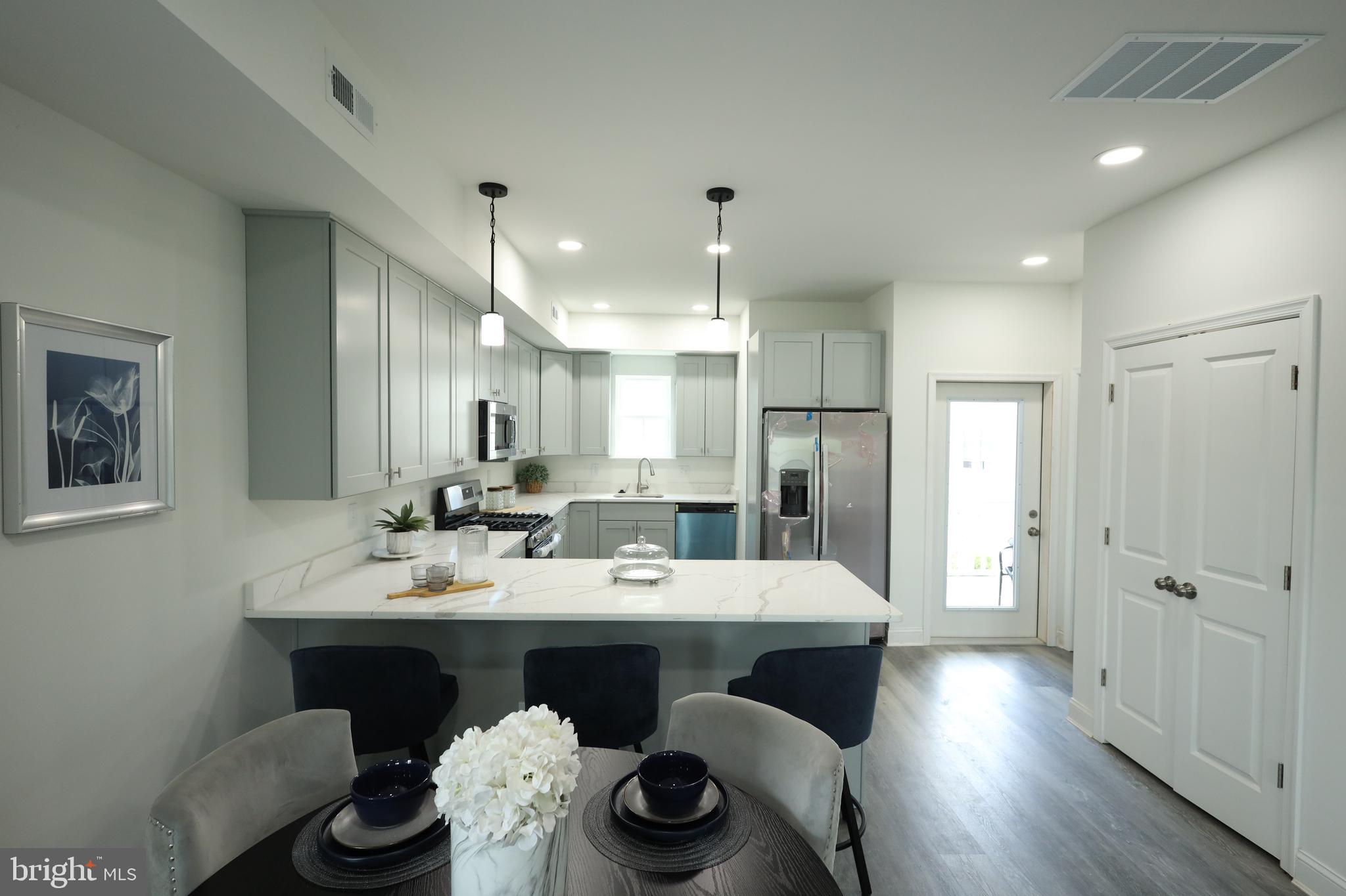 3316 North Market Street Wilmington, DE 19802 - Photo 2 of 40 a large kitchen with a table and chairs