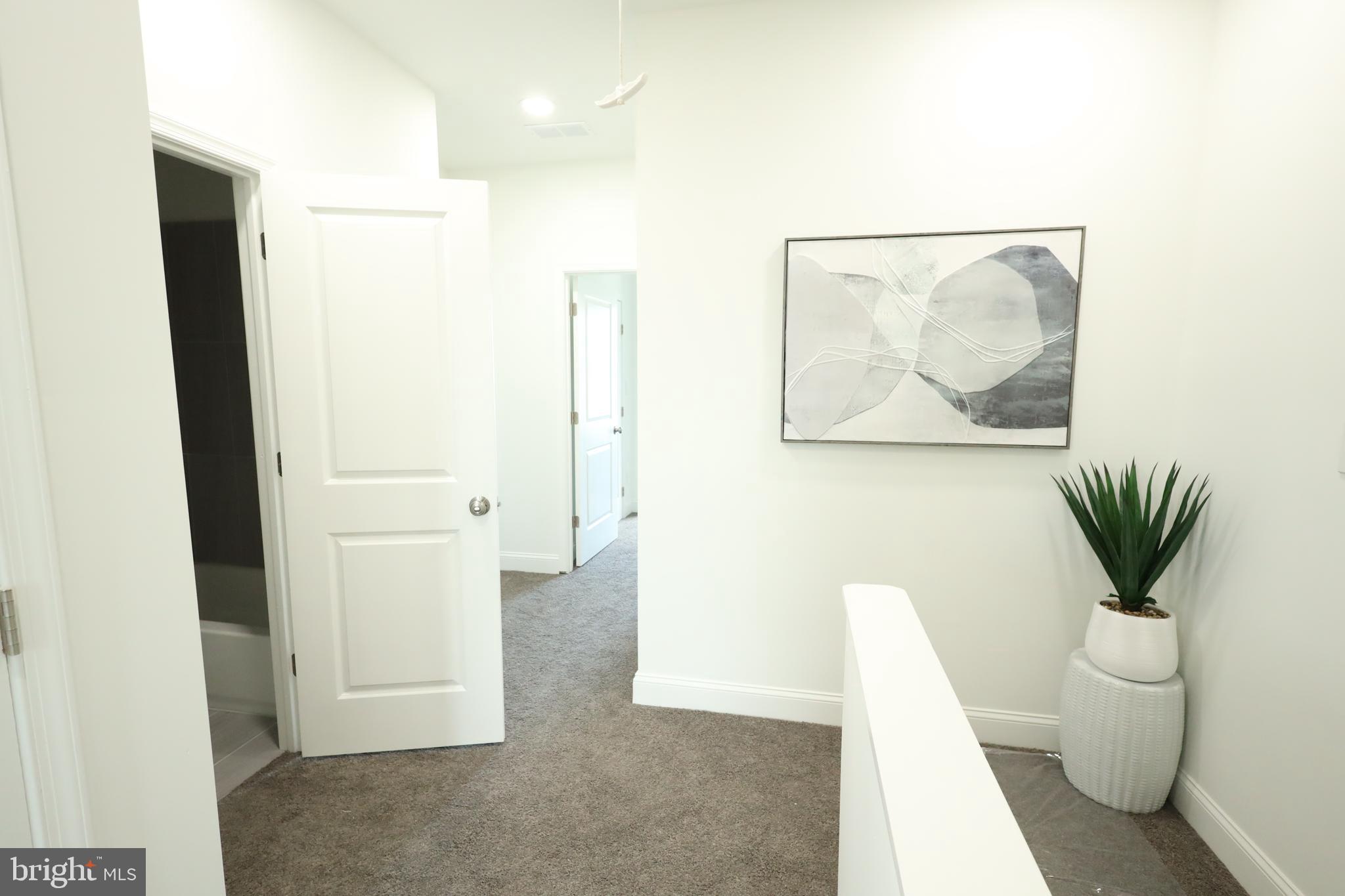 3316 North Market Street Wilmington, DE 19802 - Photo 25 of 40 a bathroom with a toilet a sink and mirror