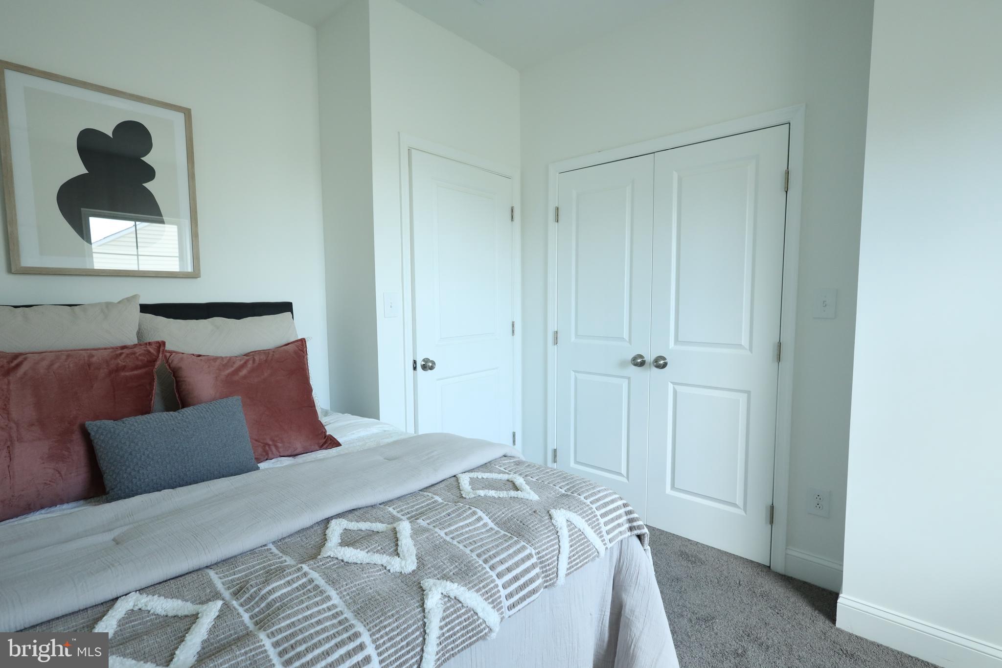 3316 North Market Street Wilmington, DE 19802 - Photo 28 of 40 a bedroom with a bed and a painting on the wall