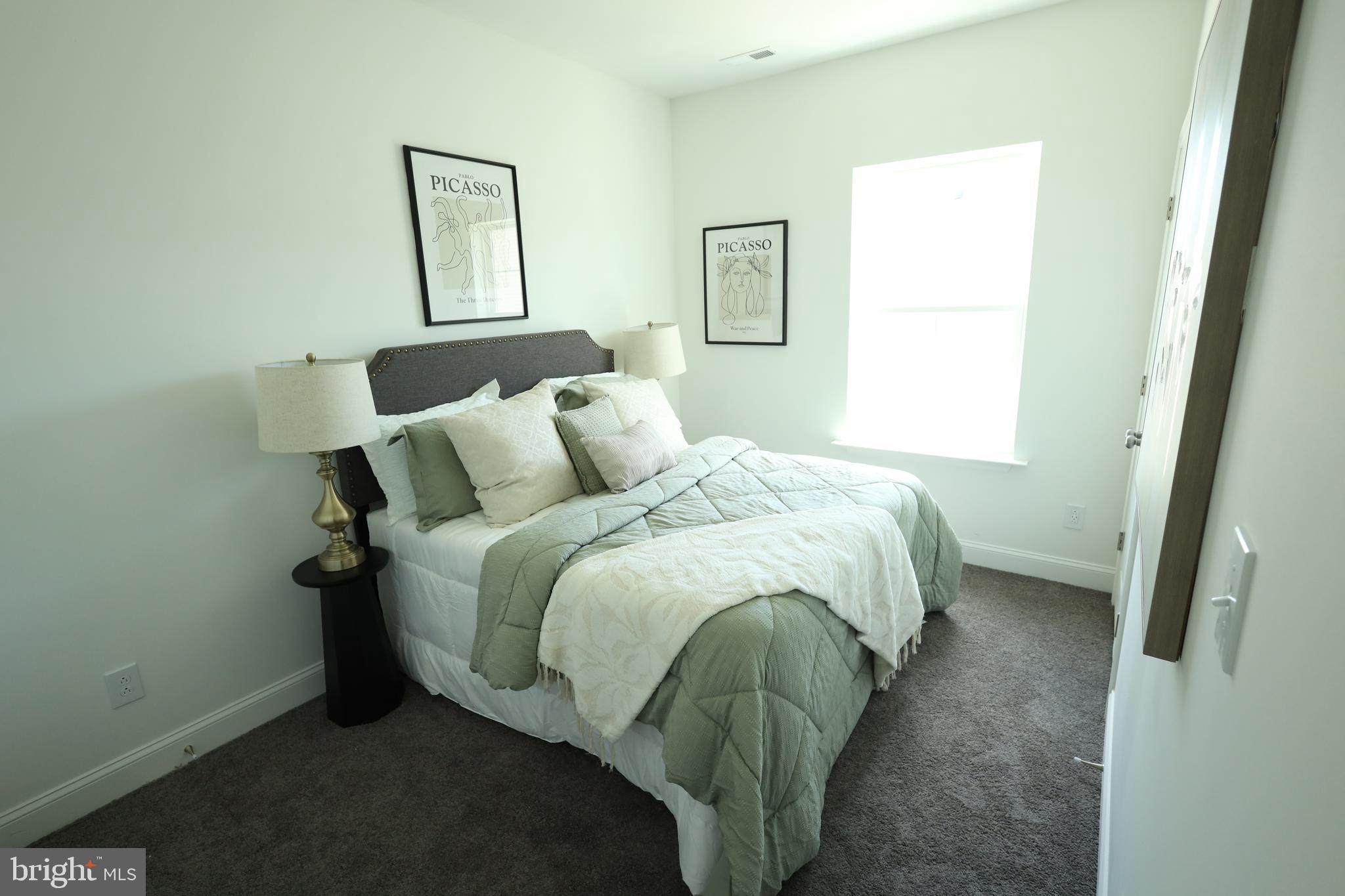 3316 North Market Street Wilmington, DE 19802 - Photo 30 of 40 a bedroom with a bed and a window