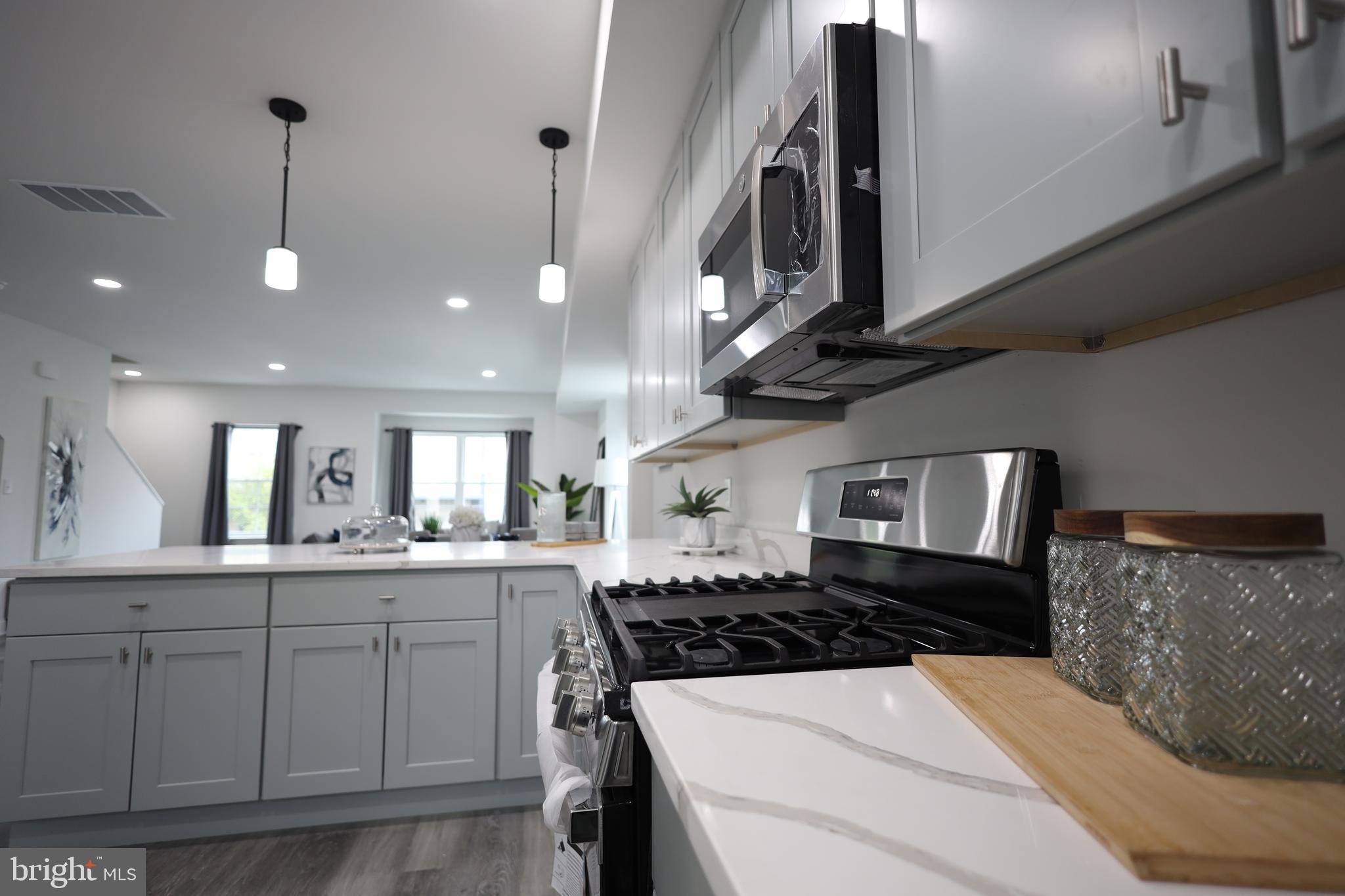 3316 North Market Street Wilmington, DE 19802 - Photo 3 of 40 a kitchen with stainless steel appliances a sink stove and cabinets