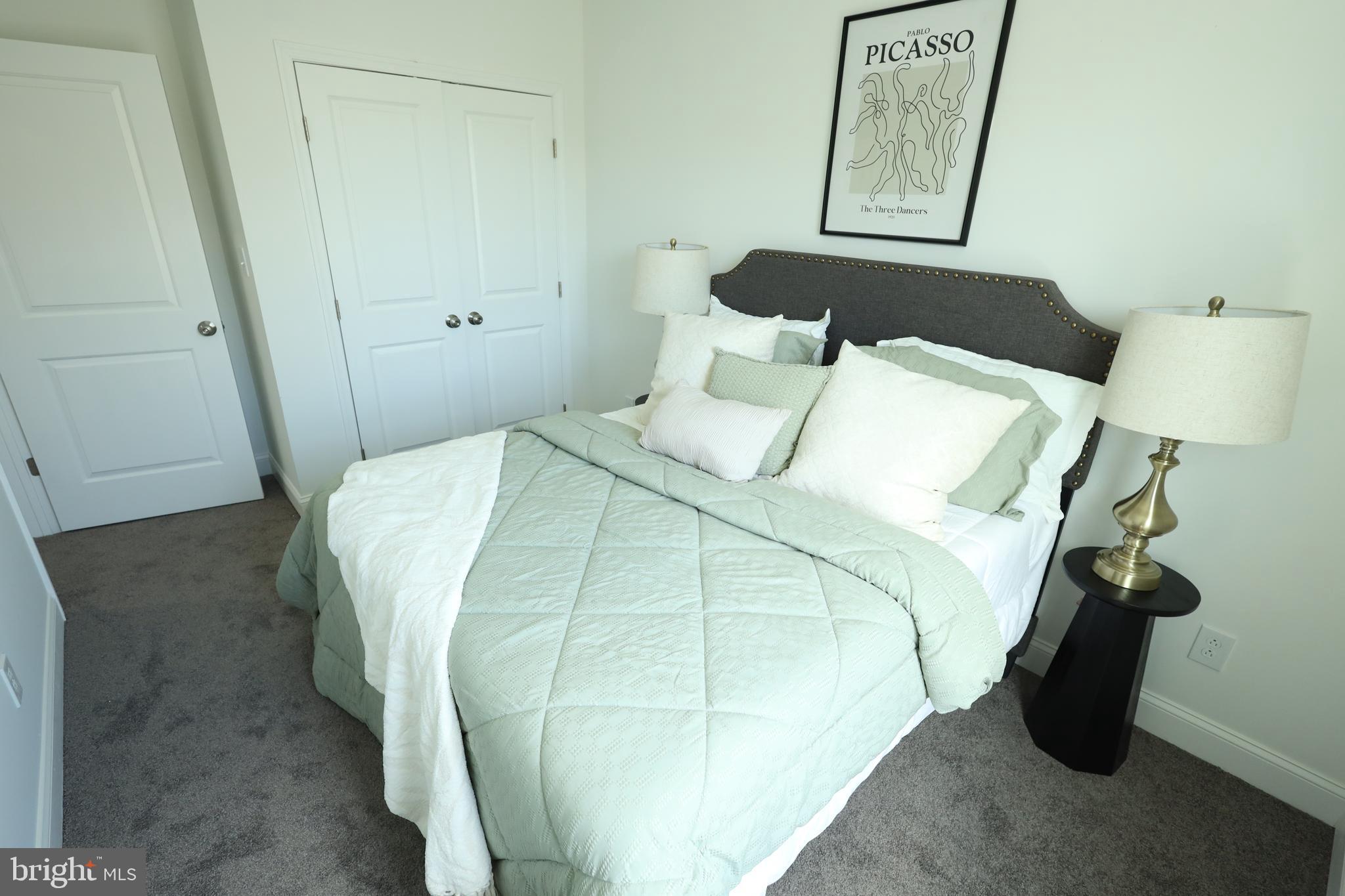 3316 North Market Street Wilmington, DE 19802 - Photo 31 of 40 a bedroom with a bed and a mirror