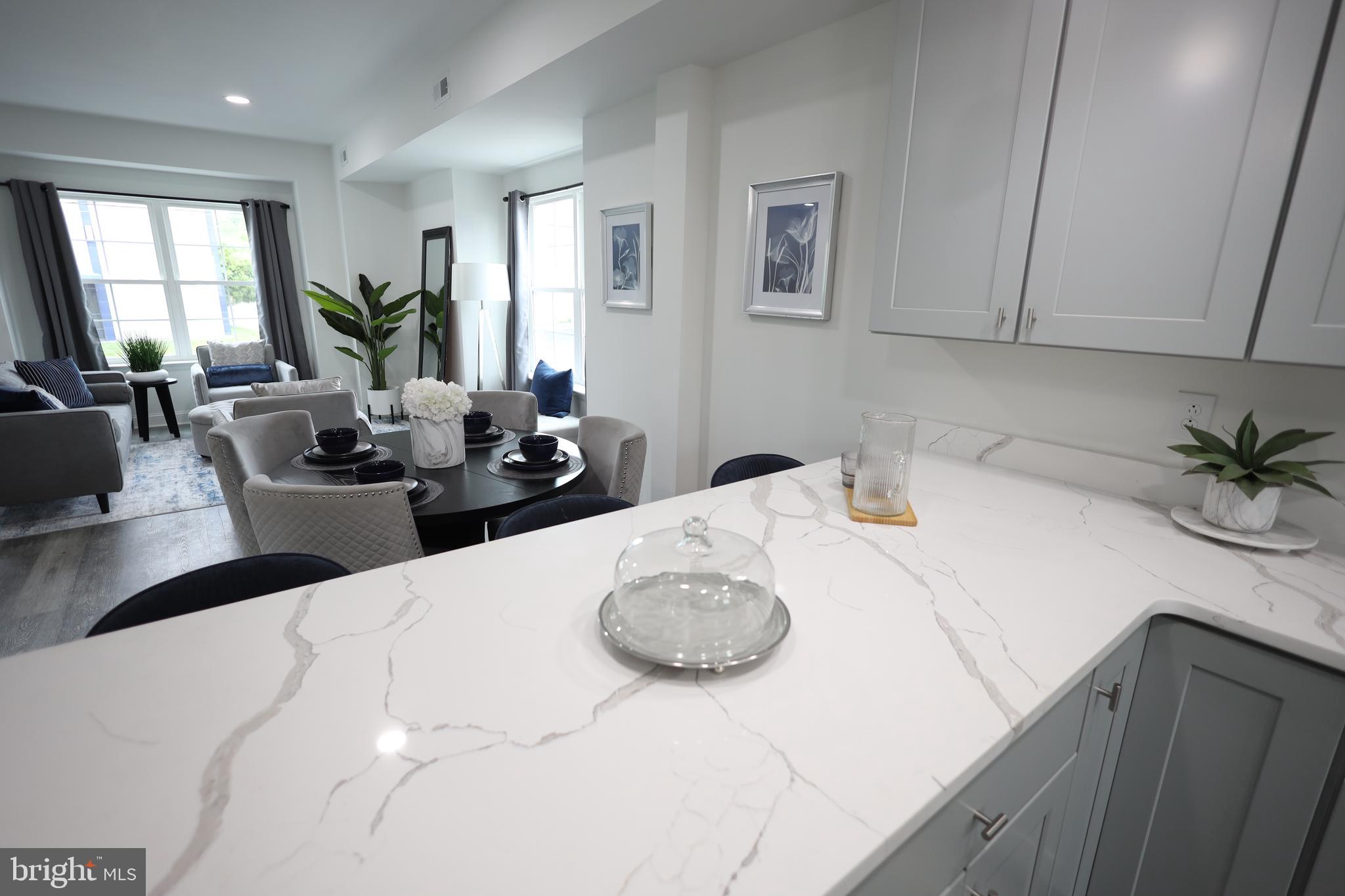 3316 North Market Street Wilmington, DE 19802 - Photo 4 of 40 a close view of dining table chairs and potted plant