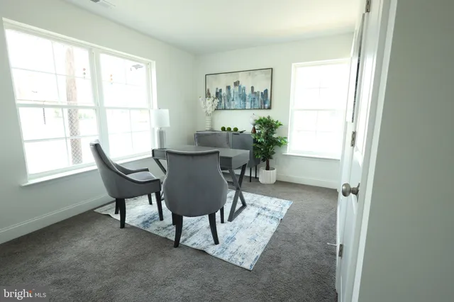 a view of a chairs and table in patio